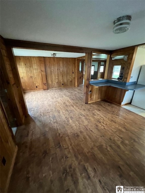 interior space featuring hardwood / wood-style floors, wooden walls, and pool table