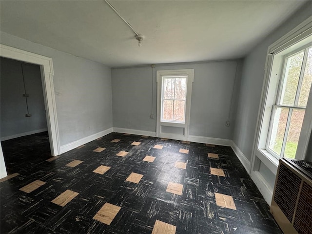 unfurnished room with a healthy amount of sunlight