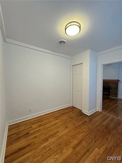 interior space featuring wood-type flooring and a closet