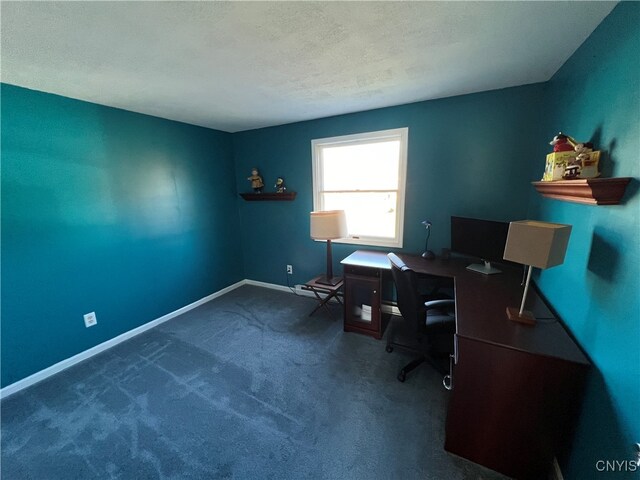 carpeted office space with a textured ceiling