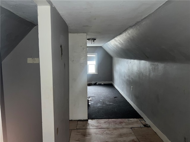 bonus room with vaulted ceiling