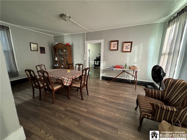 dining room with dark wood-type flooring