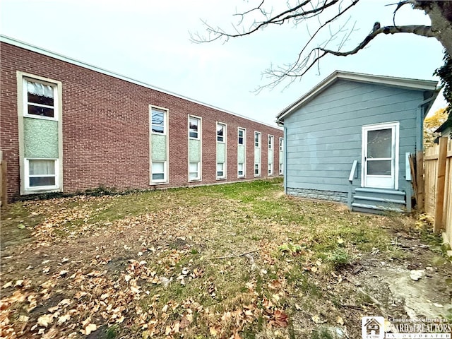 view of property exterior with a yard