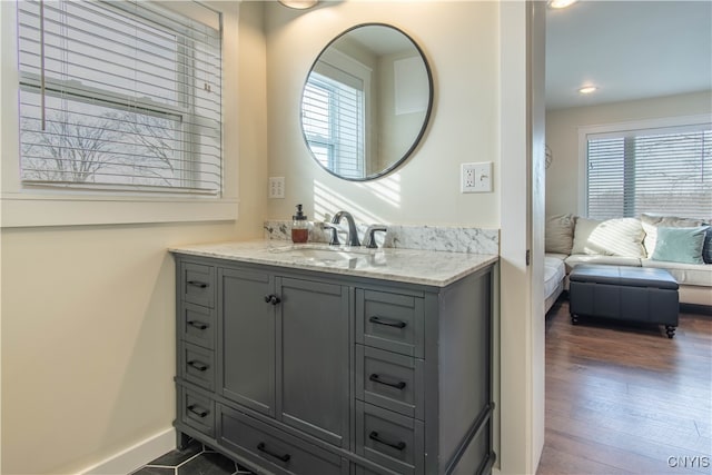 bathroom featuring hardwood / wood-style floors and vanity