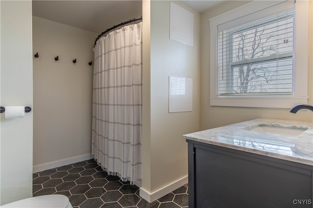 bathroom with a shower with curtain, vanity, and toilet