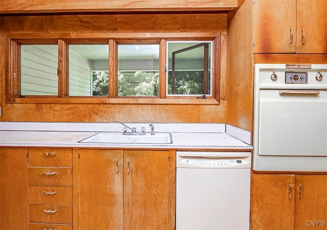 kitchen with white appliances and sink