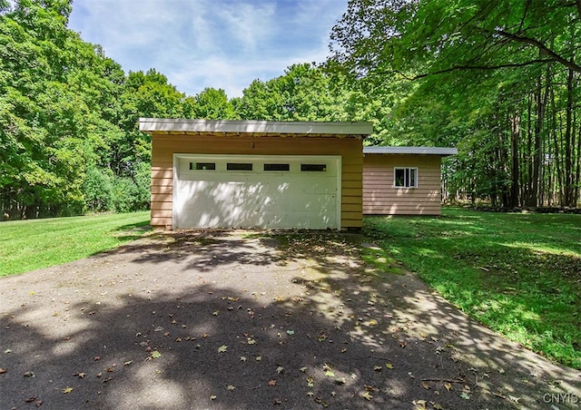 garage featuring a yard