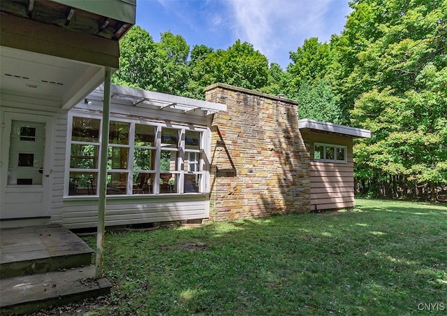 view of home's exterior with a lawn