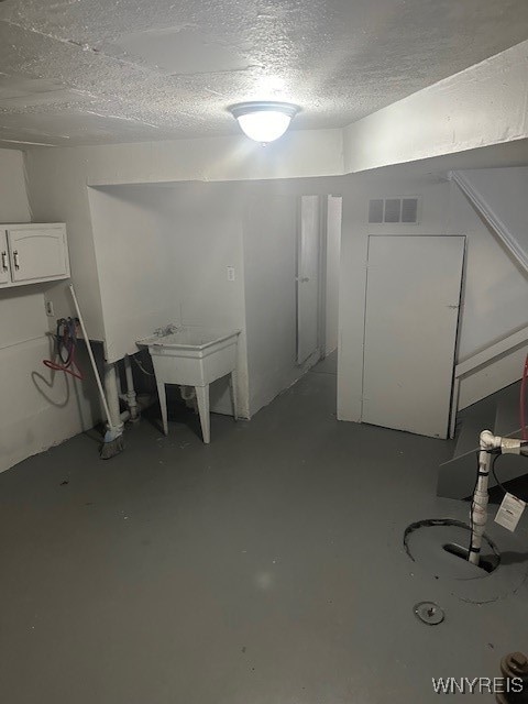 basement with a textured ceiling