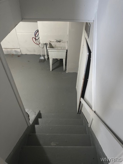 stairs with concrete floors