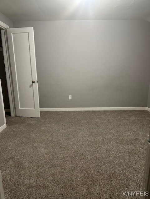 unfurnished room featuring carpet