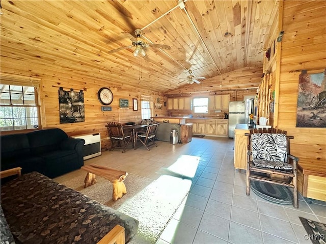 tiled living room with high vaulted ceiling, ceiling fan, wood walls, and wood ceiling