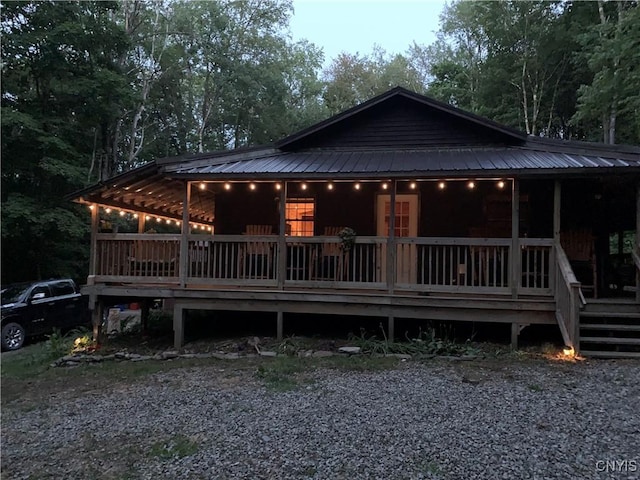 view of back house at dusk