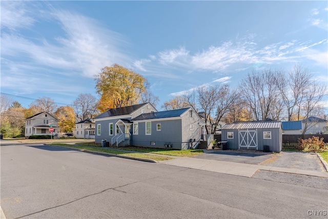 view of front of home with a storage unit