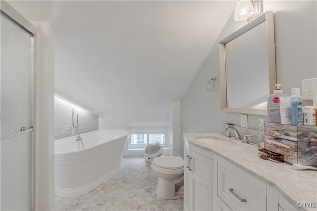 bathroom featuring a bath, tile patterned floors, vaulted ceiling, toilet, and vanity