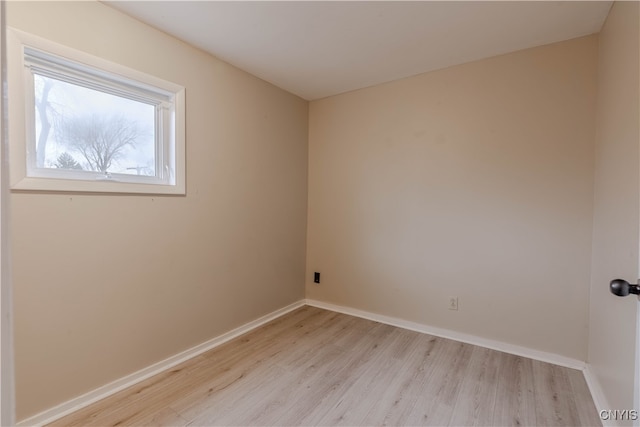 spare room featuring light hardwood / wood-style flooring