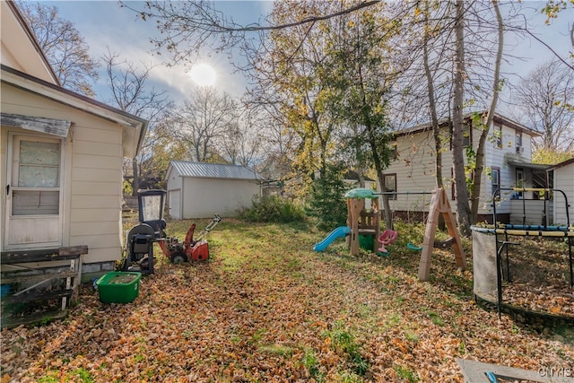view of yard featuring an outbuilding and a playground