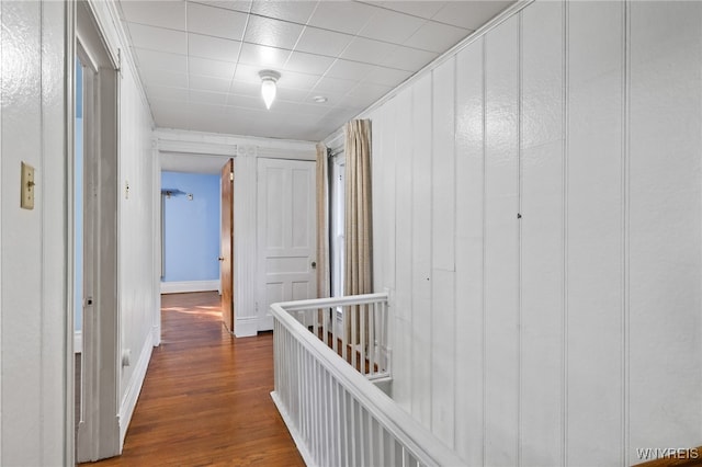 corridor with dark hardwood / wood-style floors