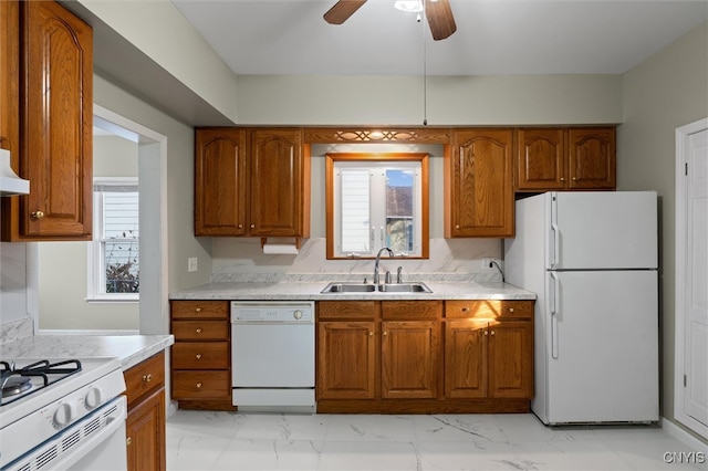 kitchen featuring ceiling fan, white appliances, and sink