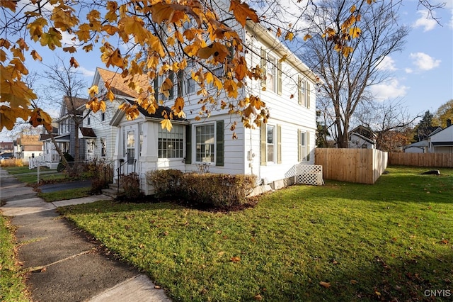 view of property exterior featuring a yard