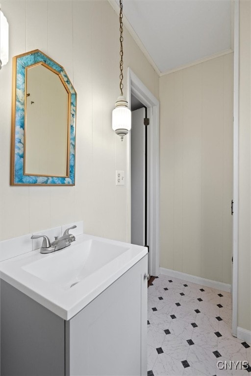 bathroom featuring crown molding and vanity