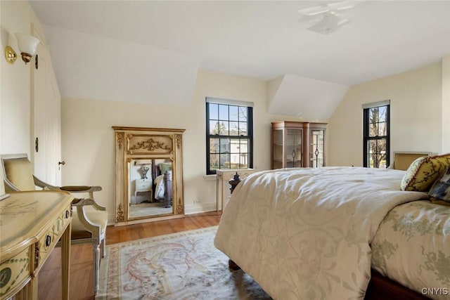 30 University Ave, Hamilton, NY 13346 - bedroom featuring wood finished floors, lofted ceiling, and baseboards