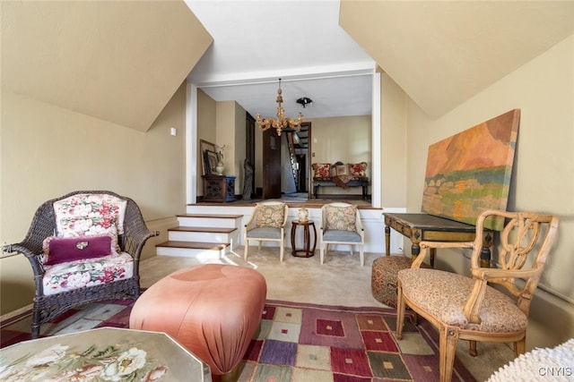 carpeted living room featuring lofted ceiling and a notable chandelier