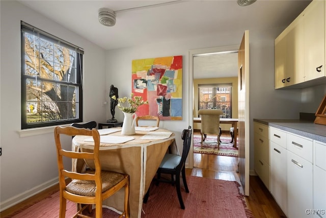 dining area with hardwood / wood-style flooring