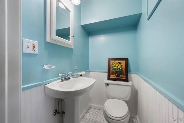 bathroom featuring tile patterned floors, sink, and toilet