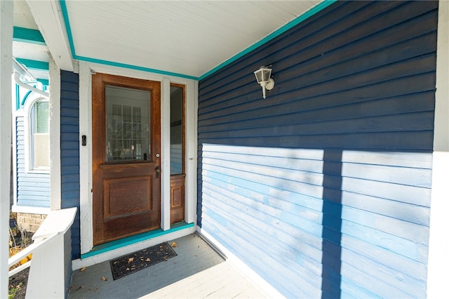 doorway to property featuring a porch