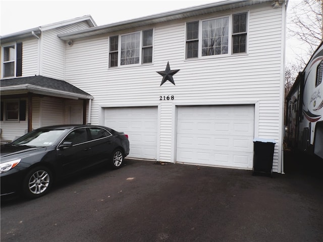 view of side of home featuring a garage