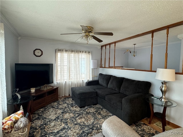 living room with wood-type flooring, a textured ceiling, ceiling fan, and crown molding