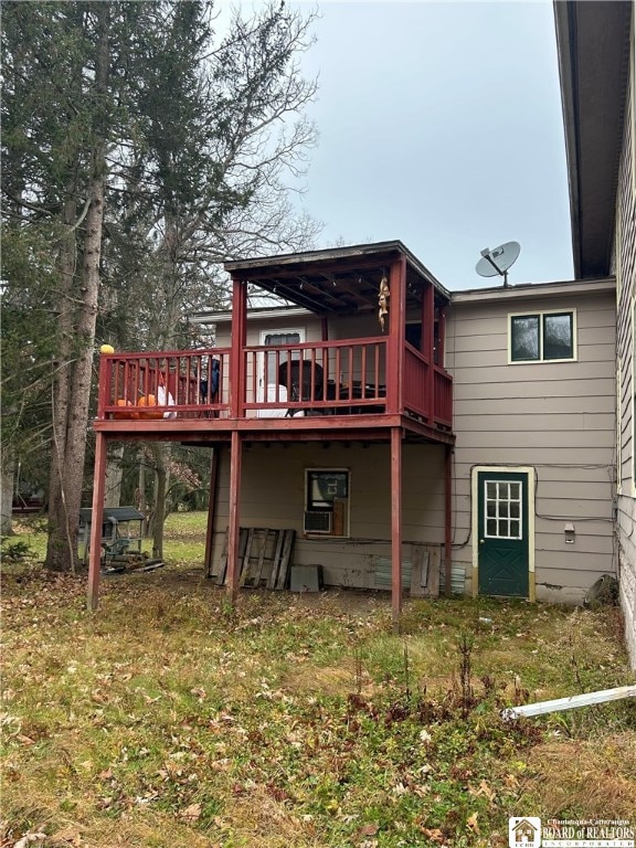 back of house featuring a wooden deck