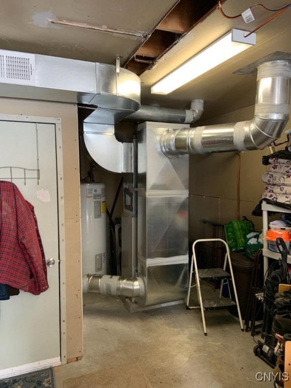 utility room featuring water heater