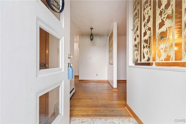 hall featuring baseboard heating and wood-type flooring