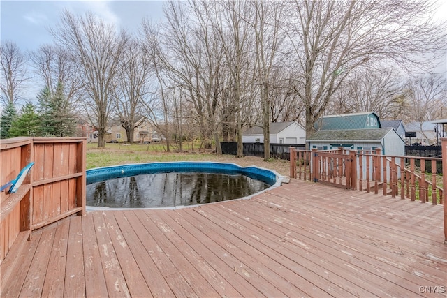 view of swimming pool featuring a deck