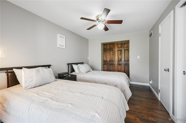 bedroom with dark hardwood / wood-style floors and ceiling fan