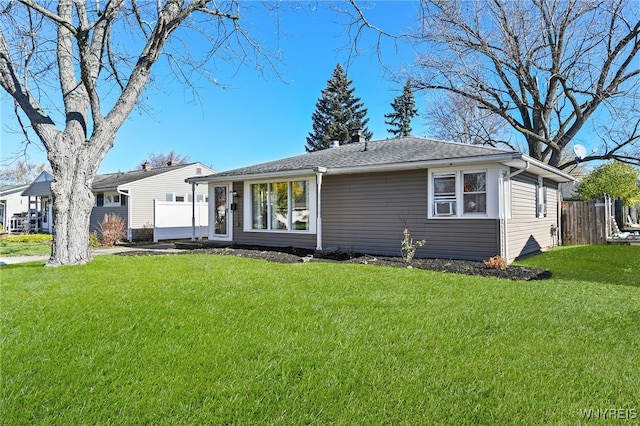 ranch-style home with a front lawn