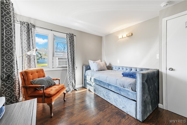 bedroom with dark wood-type flooring