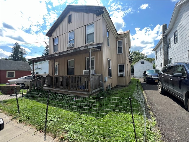 view of home's exterior featuring a porch and a lawn