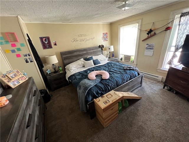 bedroom with dark colored carpet, a baseboard heating unit, a textured ceiling, and multiple windows