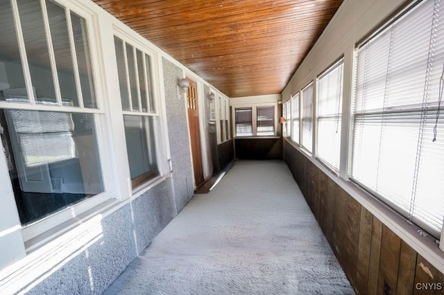 sunroom featuring wood ceiling