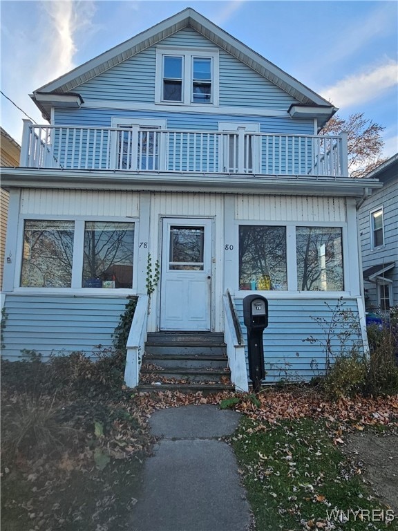 view of front of home with a balcony