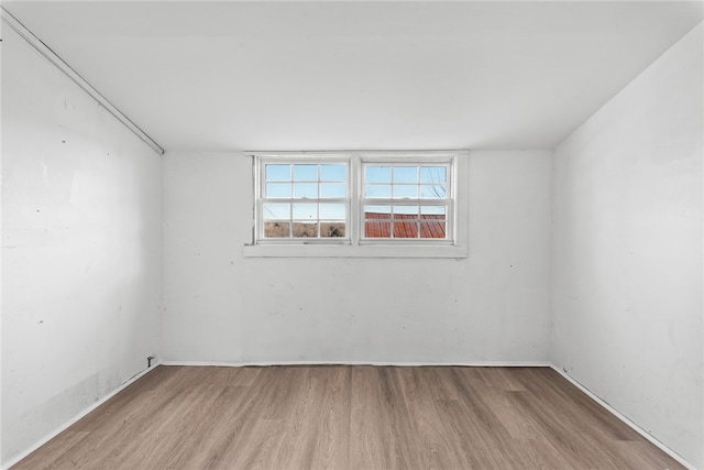 unfurnished room featuring light hardwood / wood-style floors