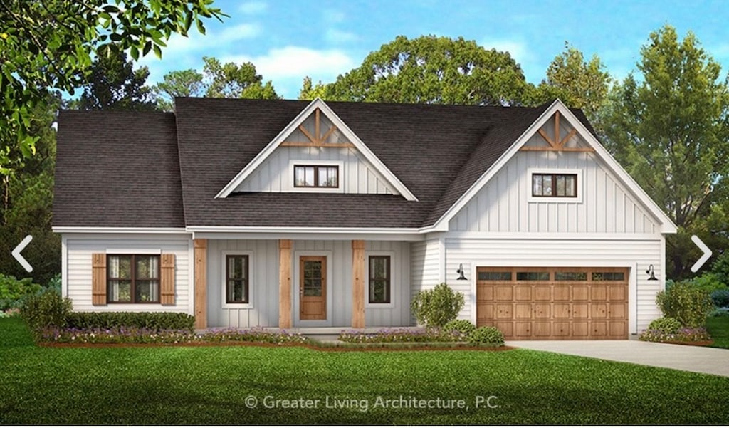 view of front facade with a porch, a garage, and a front yard