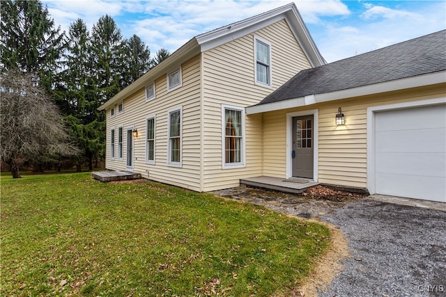 view of front of property with a garage and a front yard