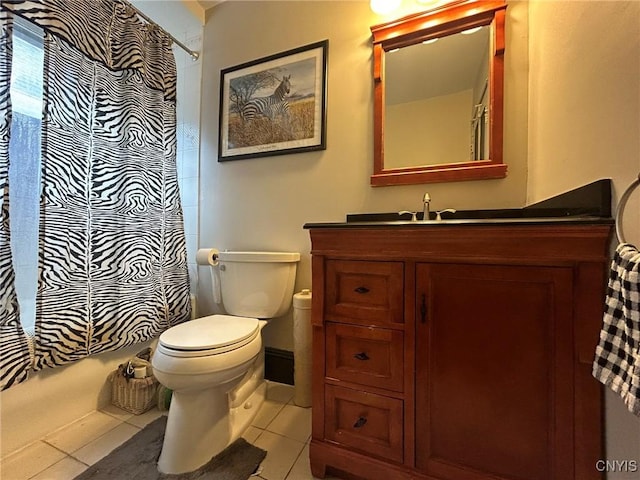 full bathroom with tile patterned floors, shower / bathtub combination with curtain, vanity, and toilet