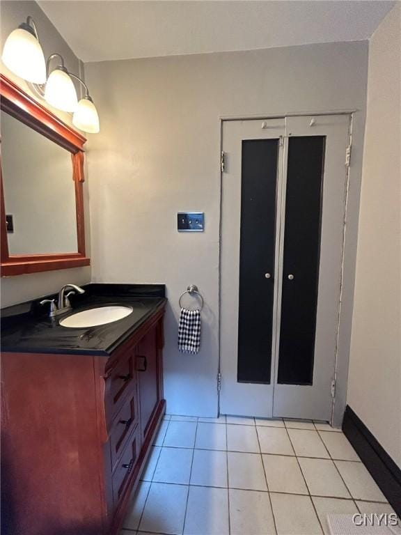 bathroom featuring tile patterned flooring and vanity