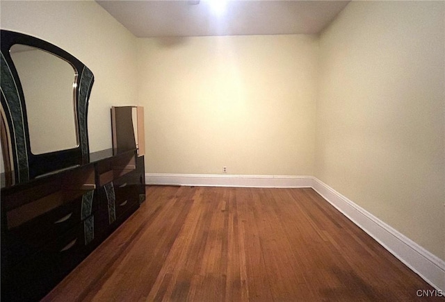 spare room featuring dark hardwood / wood-style flooring