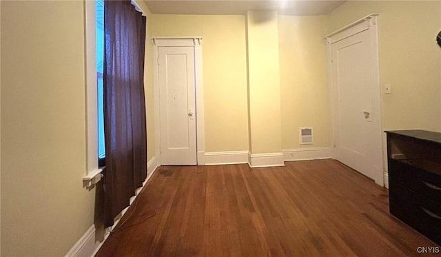 interior space with dark wood-type flooring